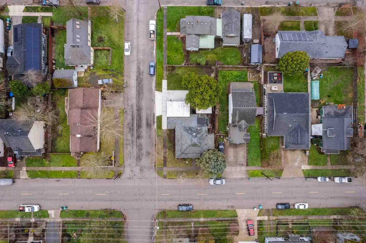 A peaceful streetscape lined with charming houses, mature trees, and a quiet road, inviting scenes of walking or biking through a friendly neighborhood. The image conveys a sense of community and accessibility.